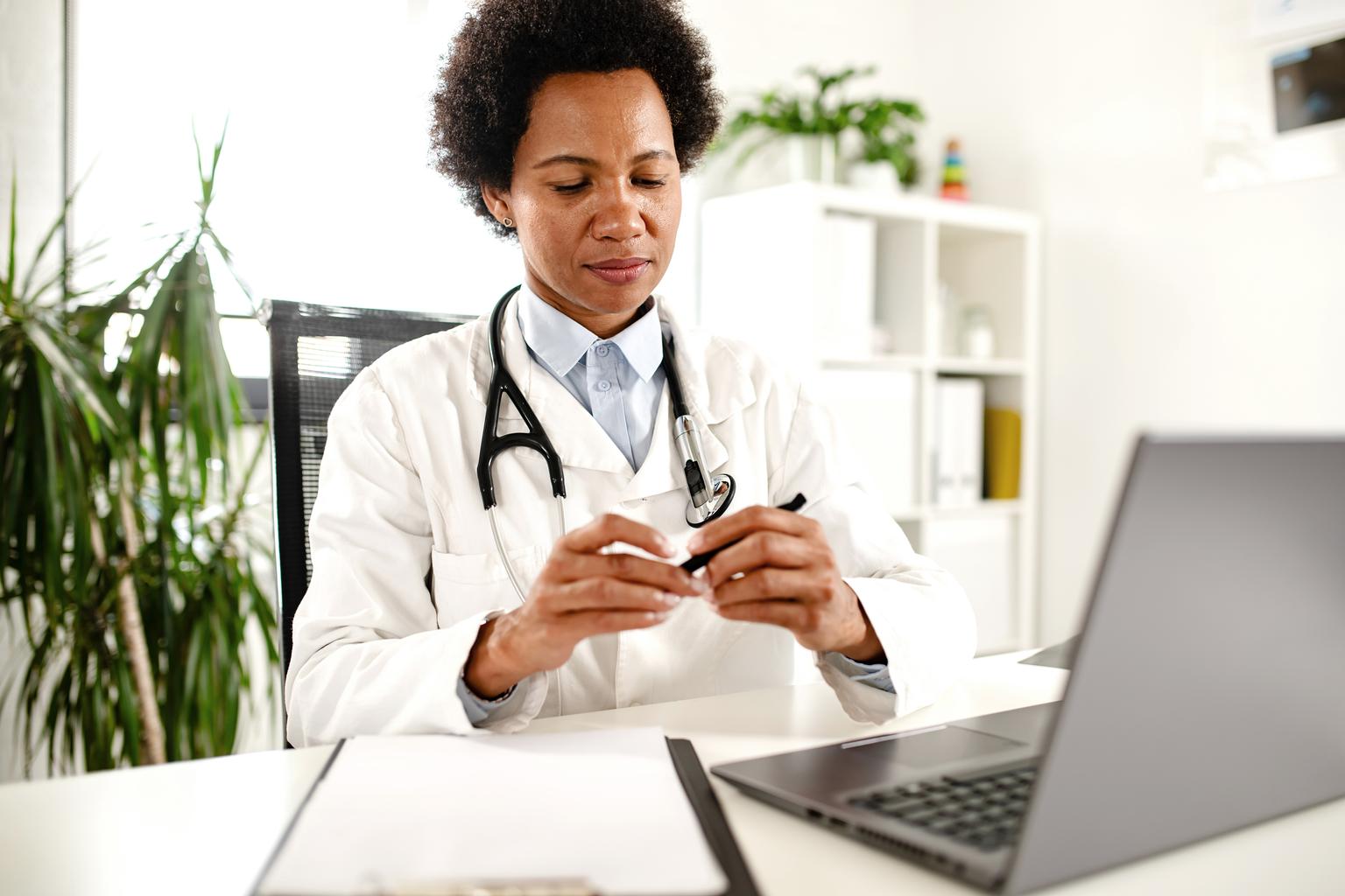 Doctor preparing for consultation with Longevity Plus care